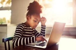 young-girl-working-on-a-computer-STEM-featured