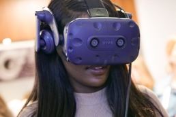 Woman wearing VR headset at the WeAreTechWomen conference
