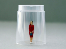 woman under a glass, breaking glass ceiling
