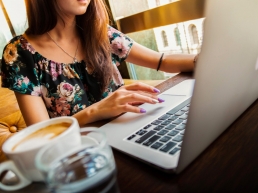 Woman typing on laptop, flexible working, gender bias