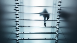 woman walking upstairs, glass ceiling