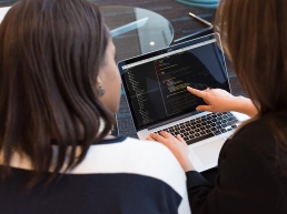 women working on code