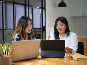 Women working on laptops, female entrepreneurs, women in tech