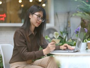 Female office worker using online banking, woman in fintech