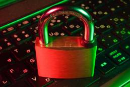 padlock on a keyboard denoting cyber security