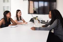 A woman at a job interview with two interviewers