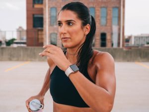 Female runner with a smart watch