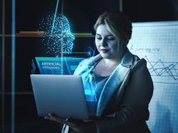 Woman using AI on laptop